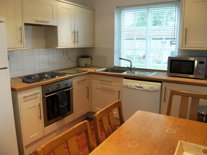 First floor flat — kitchen with dining table